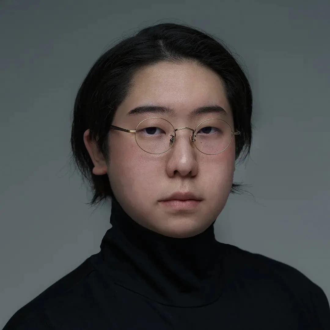 Image of Sukone Hong with a grey studio background