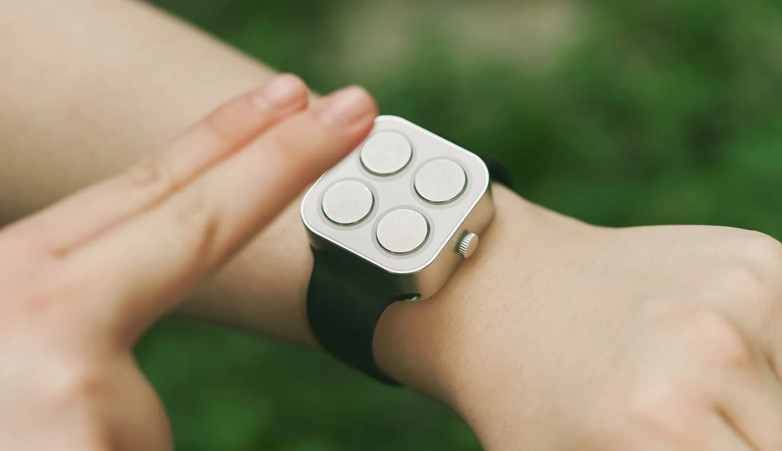 Image of a person using a braille watch