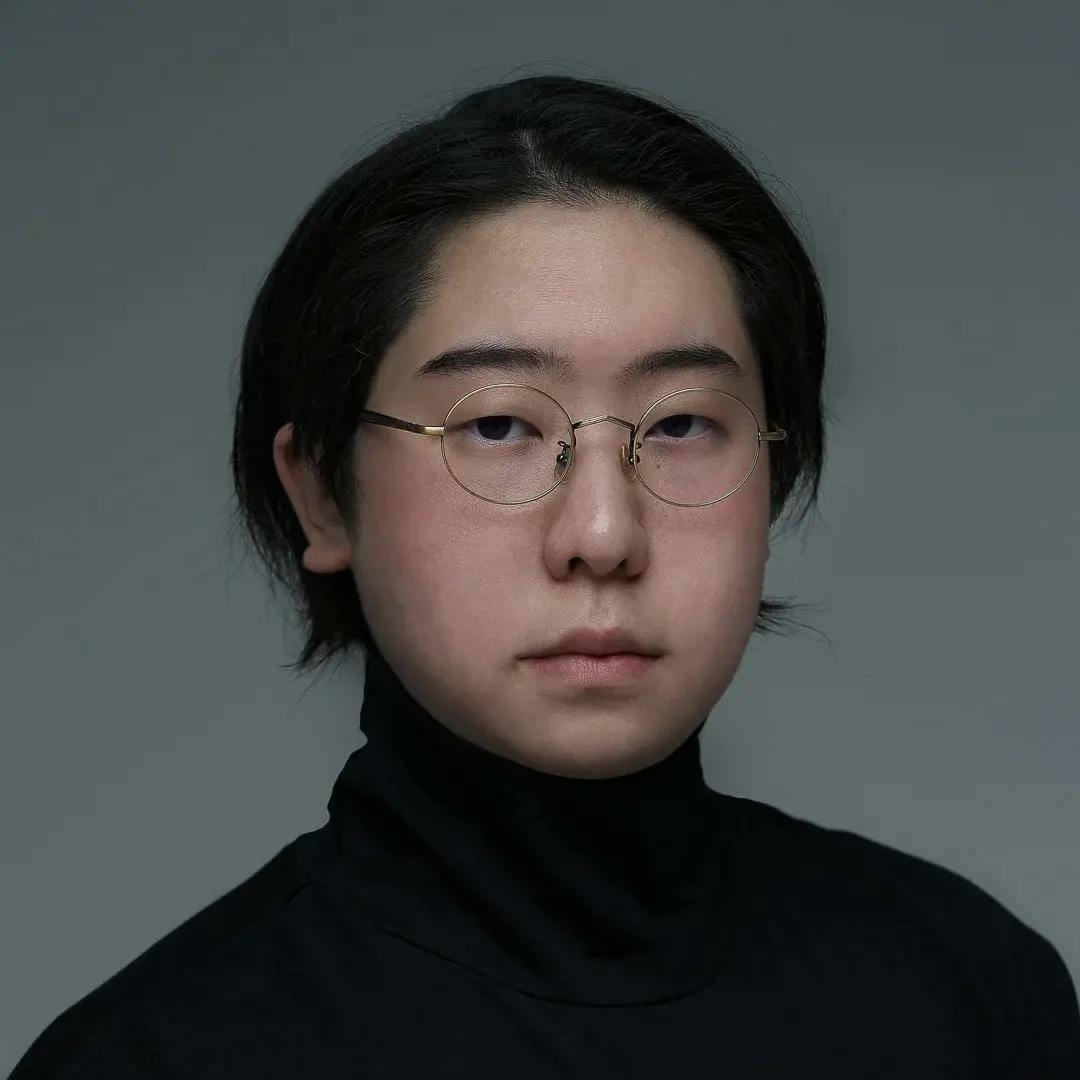 Image of Sukone Hong with a grey studio background